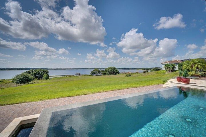 Groveland Home w / Pool: Luxurious Lakefront Oasis!