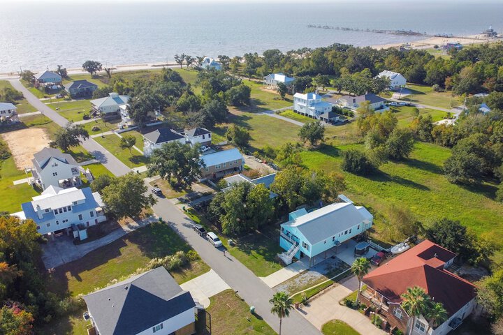 Sunny Waveland Home Rental w / Pool: Walk to Beach!
